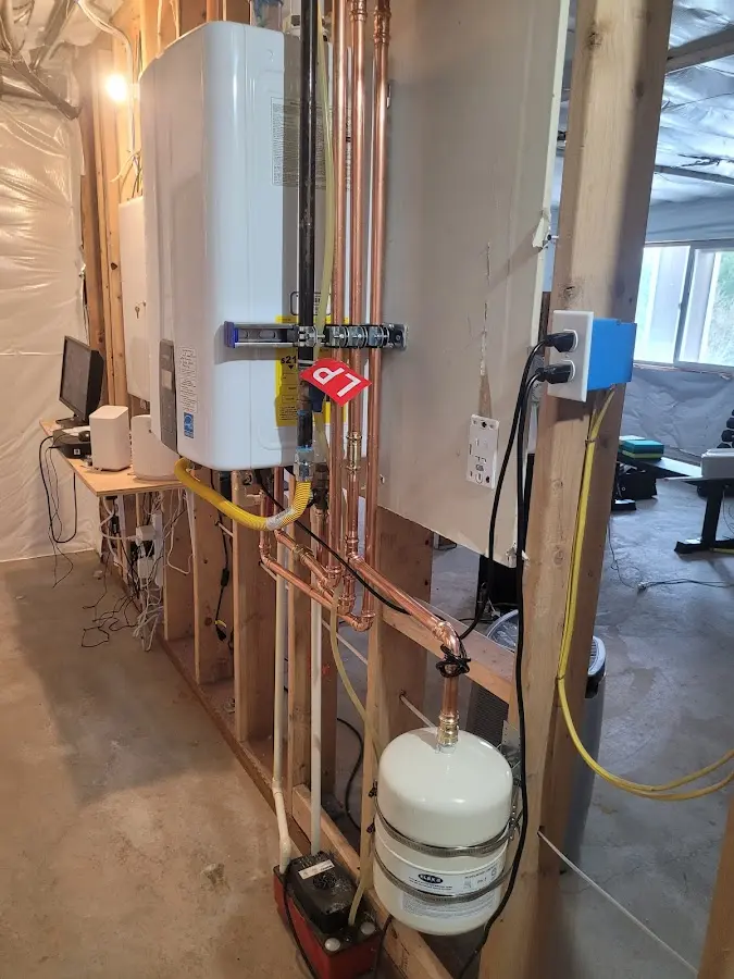 Licensed plumber repairing a kitchen sink in Clanton